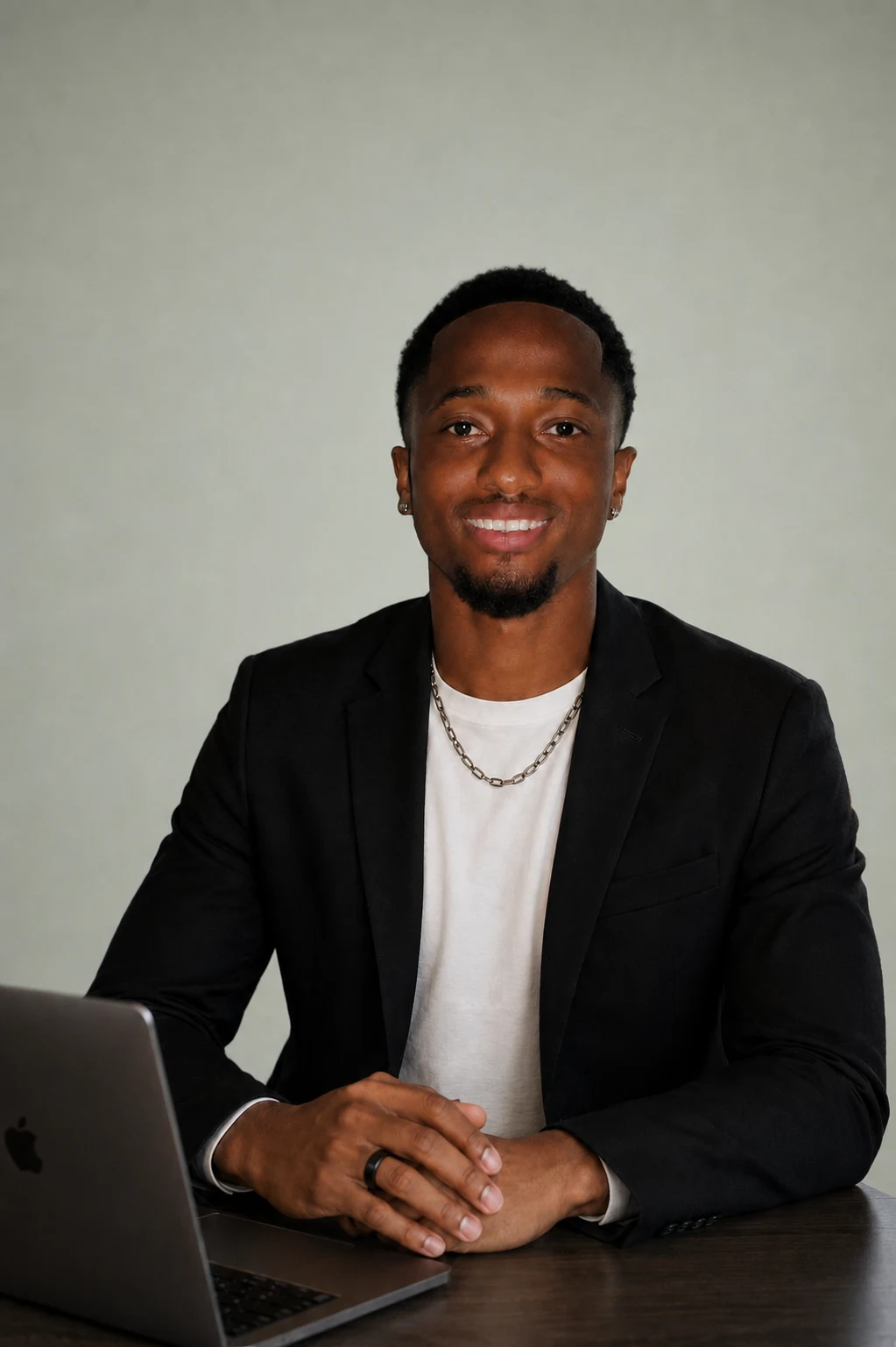 Moses Koroma, founder of TurnLogic AI, seated at a desk